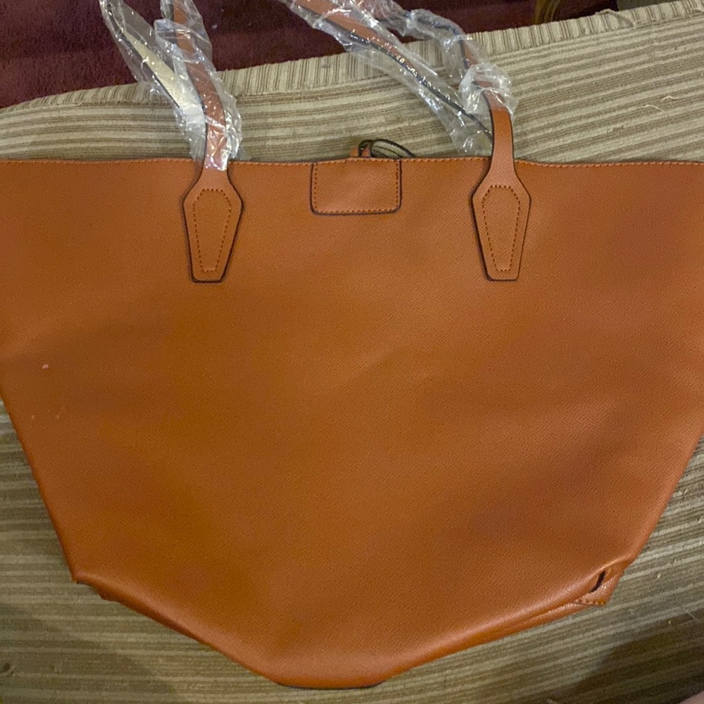 unused tan shoulder bag.